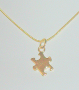 Gold-filled puzzle piece necklace
